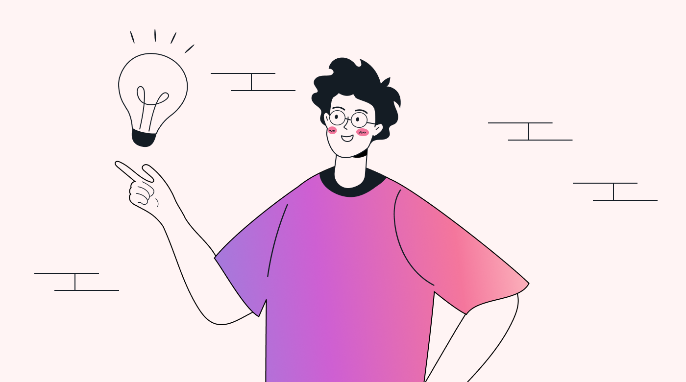 A person smiling at a light bulb in their hand